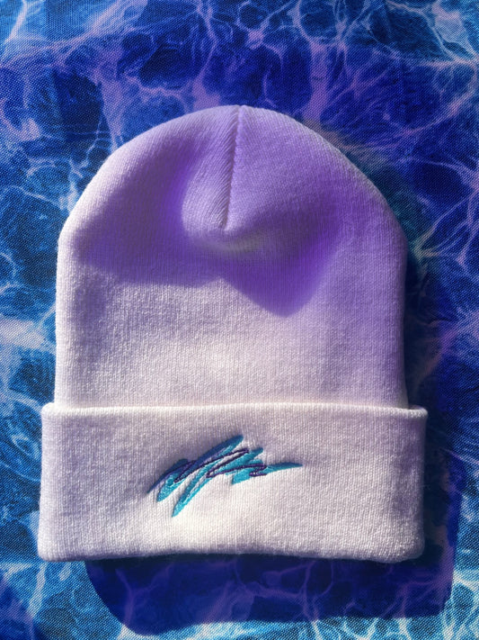 White beanie with blue embroidery on a blue textured background